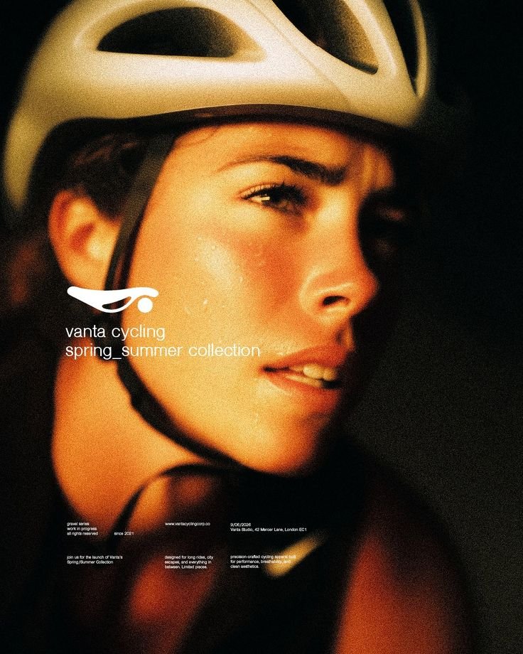Close-up of a cyclist in a white helmet in warm evening light